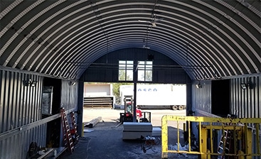 https://www.torosteelbuildings.com/wp-content/uploads/2020/07/uses-and-options-for-steel-shipping-container-covers-img2.jpg