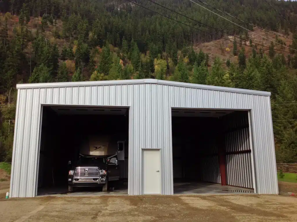 Large steel garage with two open roll-up bays