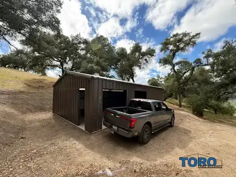 Dark brown steel garage with roll-up doors